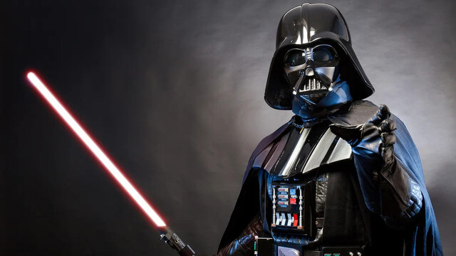 Darth Vader with a lightsaber from the Star Wars franchise
